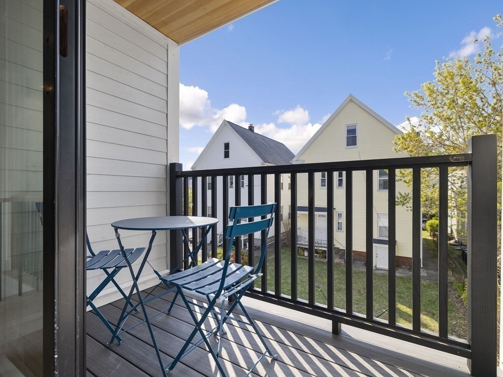 9 B Harrison Road, Unit 9B Somerville, MA 02144 - Photo 7 of 21 a view of balcony with wooden floor and outdoor seating