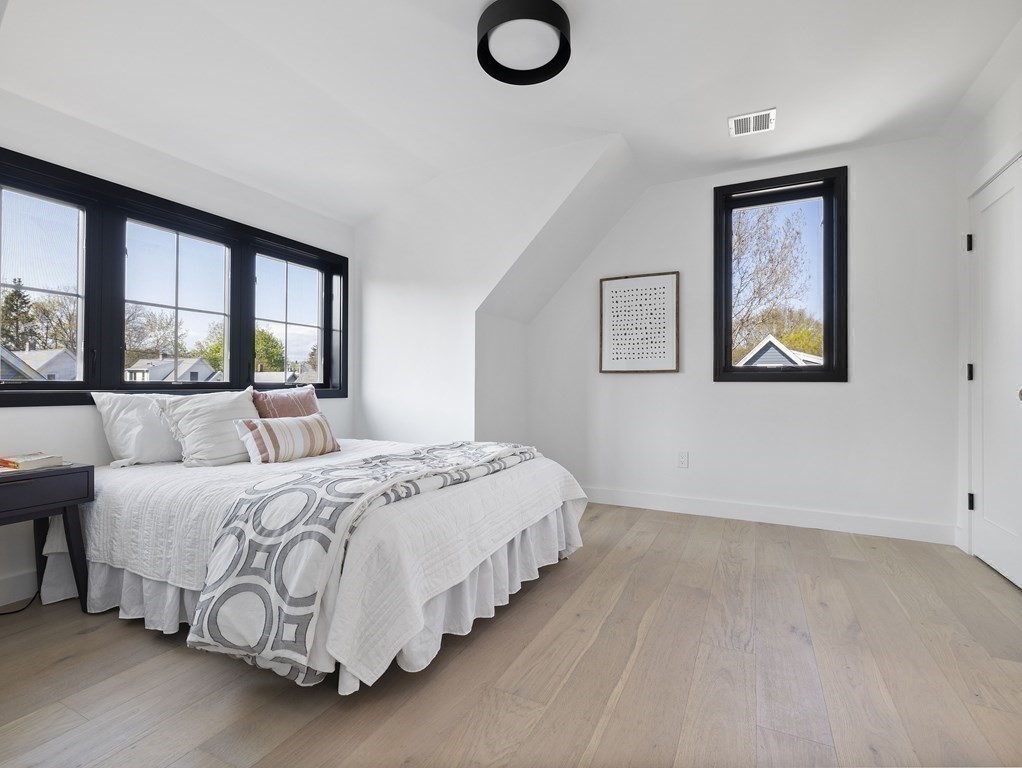 9 B Harrison Road, Unit 9B Somerville, MA 02144 - Photo 10 of 21 a bedroom with a large bed and a window