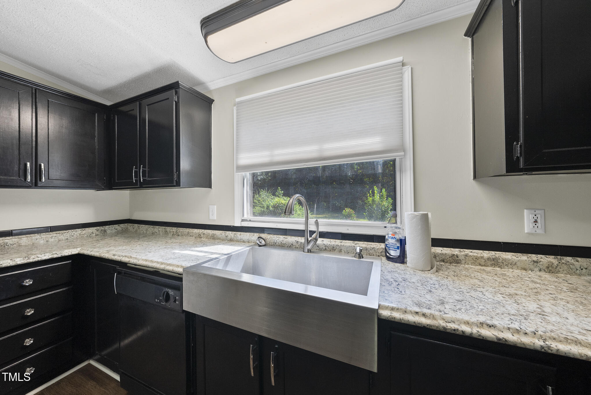 186 Saplin Branch Road Timberlake, NC 27583 - Photo 11 of 46 a kitchen with a sink and a window
