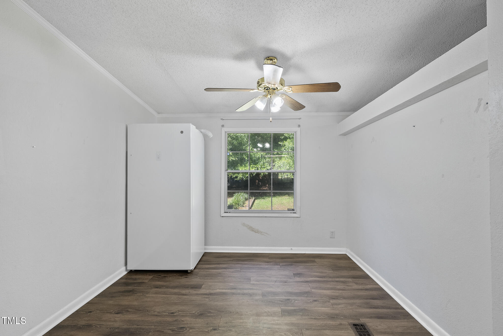 186 Saplin Branch Road Timberlake, NC 27583 - Photo 12 of 46 a view of an empty room with wooden floor and a window