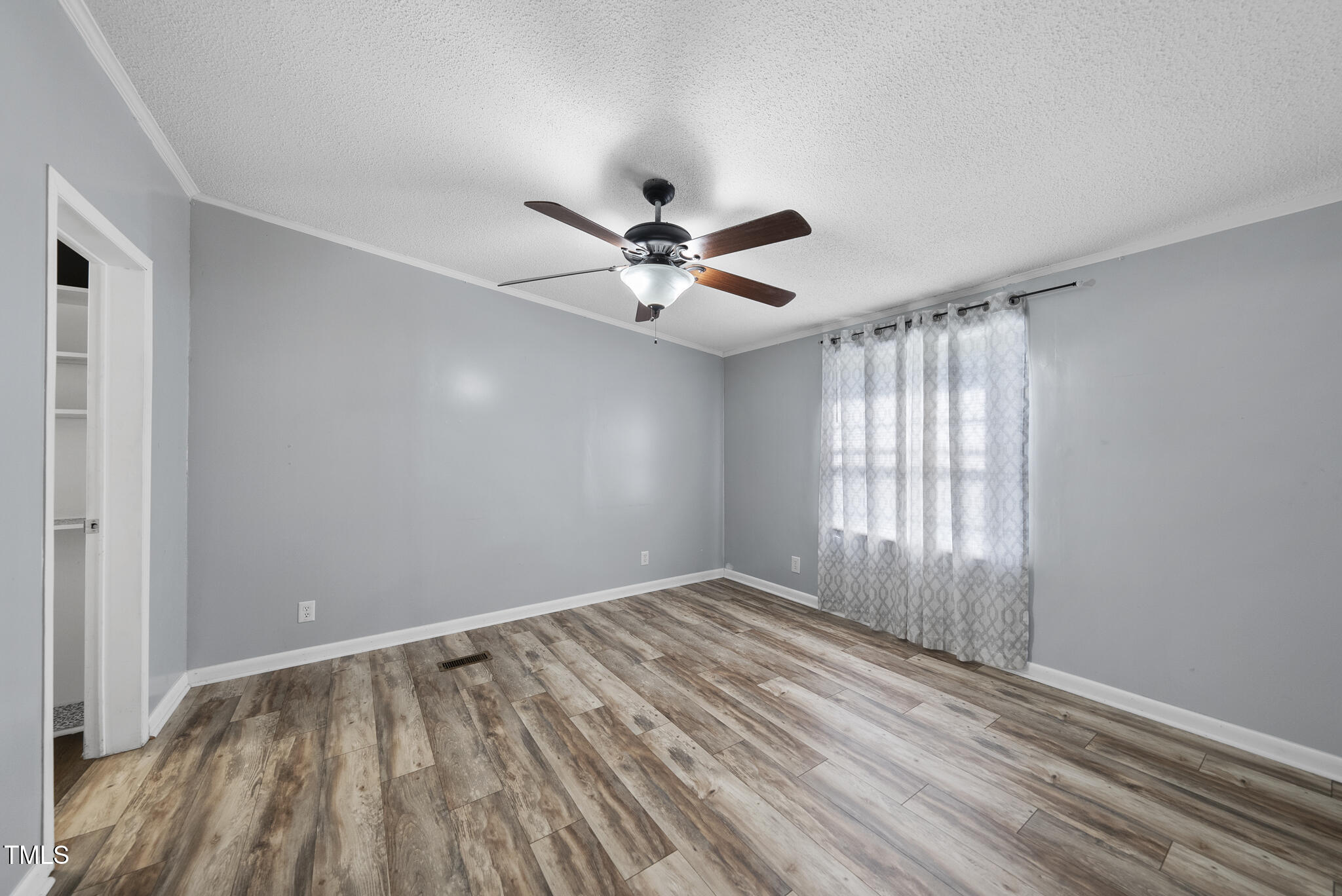 186 Saplin Branch Road Timberlake, NC 27583 - Photo 14 of 46 wooden floor in a room with a window