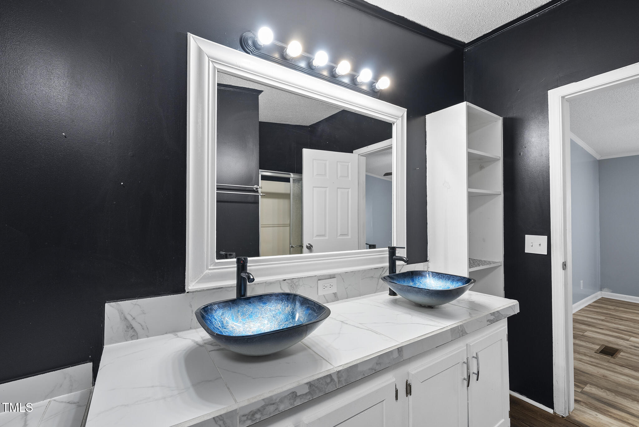 186 Saplin Branch Road Timberlake, NC 27583 - Photo 17 of 46 a bathroom with a sink and a mirror