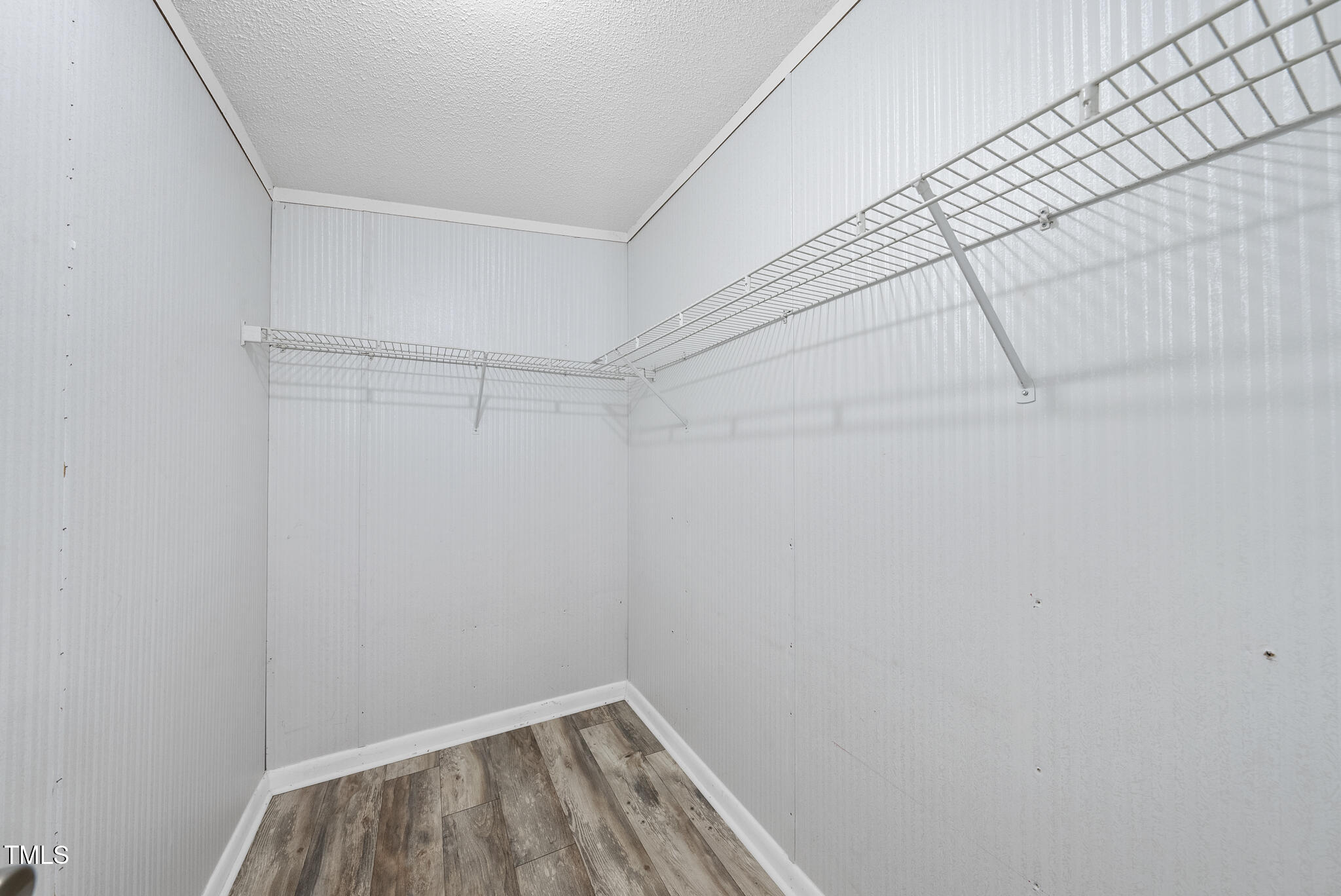 186 Saplin Branch Road Timberlake, NC 27583 - Photo 24 of 46 a view of a room with racks on the wall