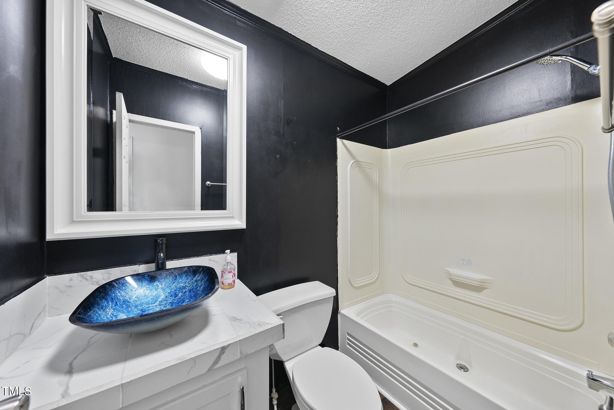 186 Saplin Branch Road Timberlake, NC 27583 - Photo 25 of 46 a bathroom with a sink and a mirror
