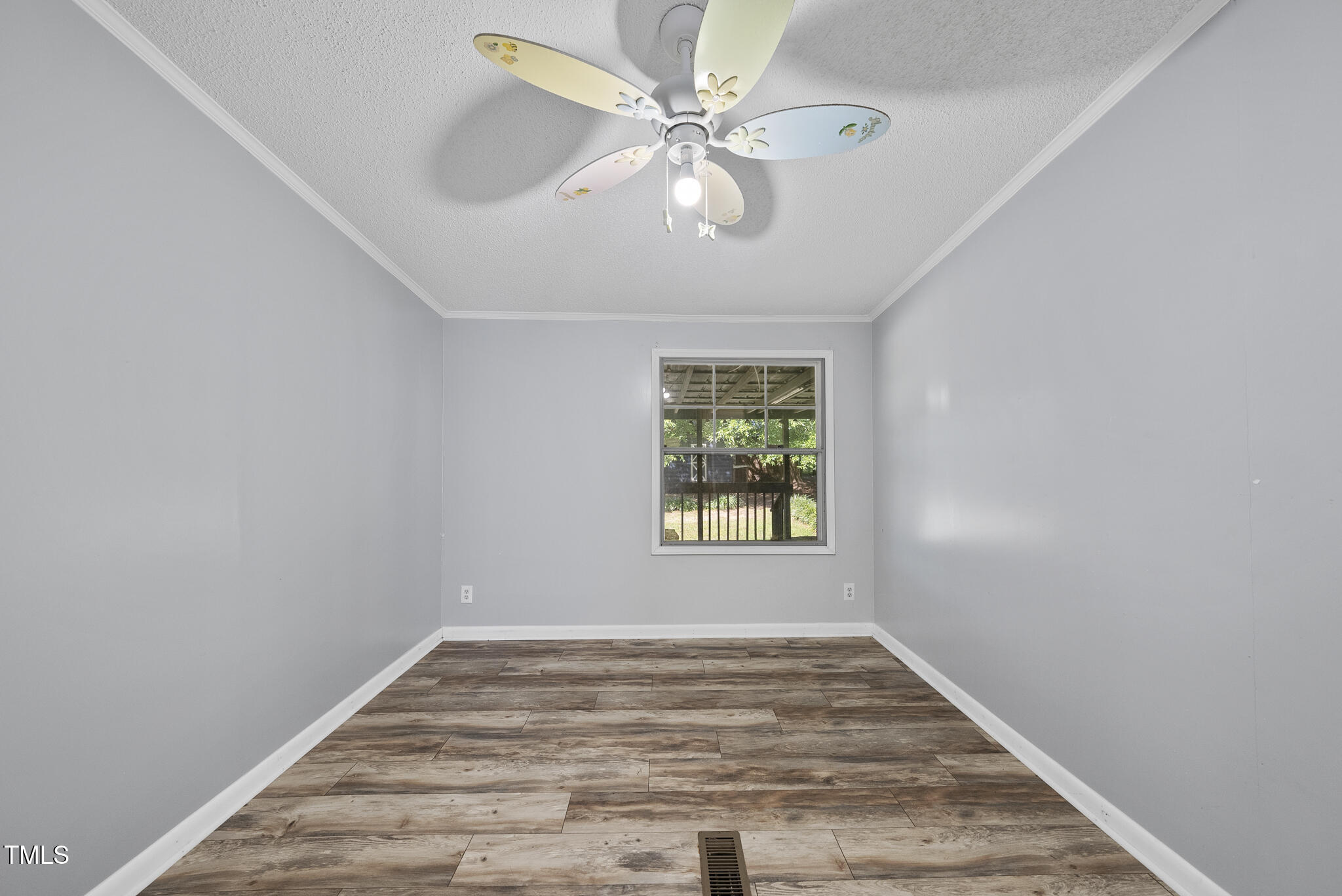 186 Saplin Branch Road Timberlake, NC 27583 - Photo 27 of 46 wooden floor in an empty room with a window
