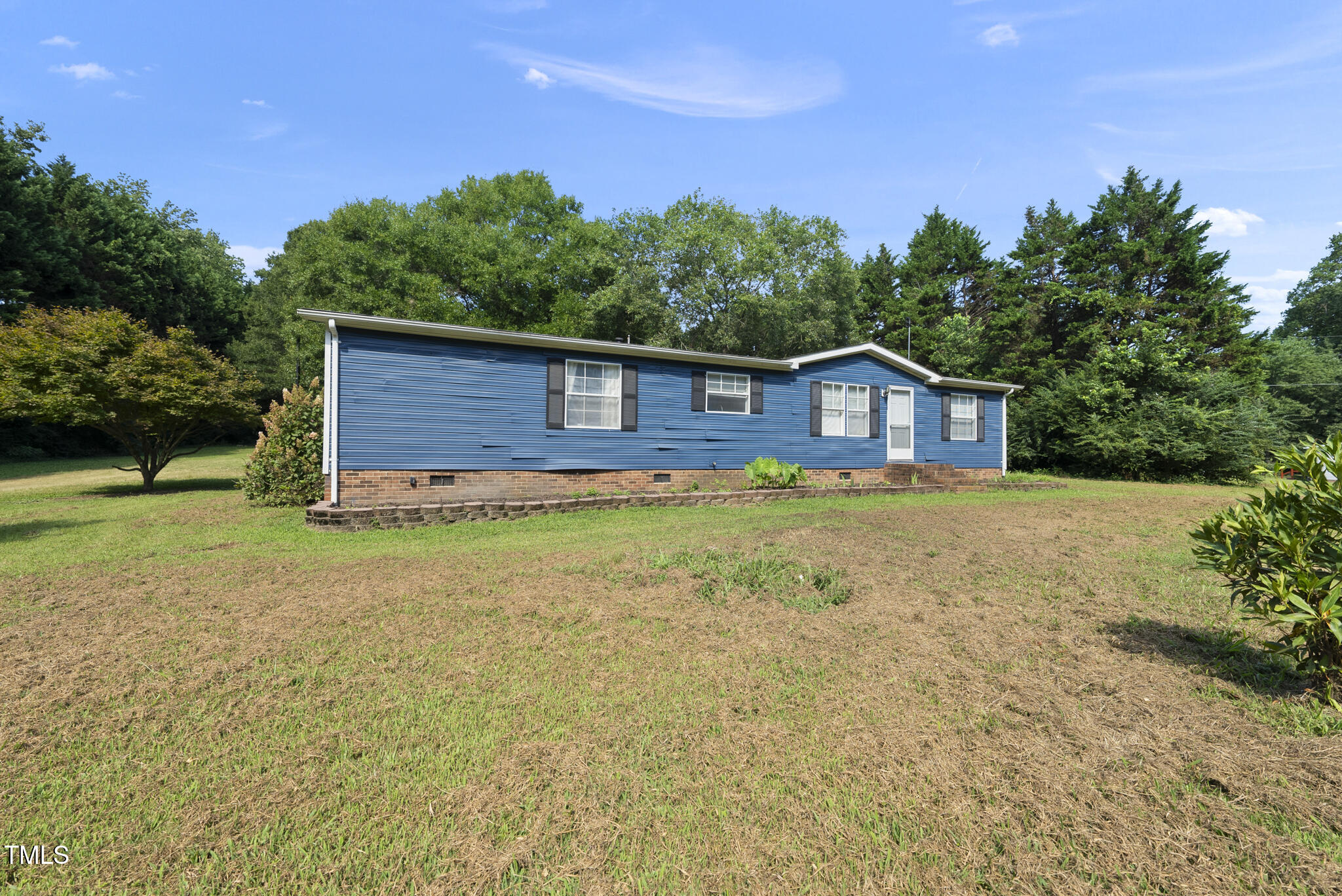 186 Saplin Branch Road Timberlake, NC 27583 - Photo 30 of 46 a house view with a garden space