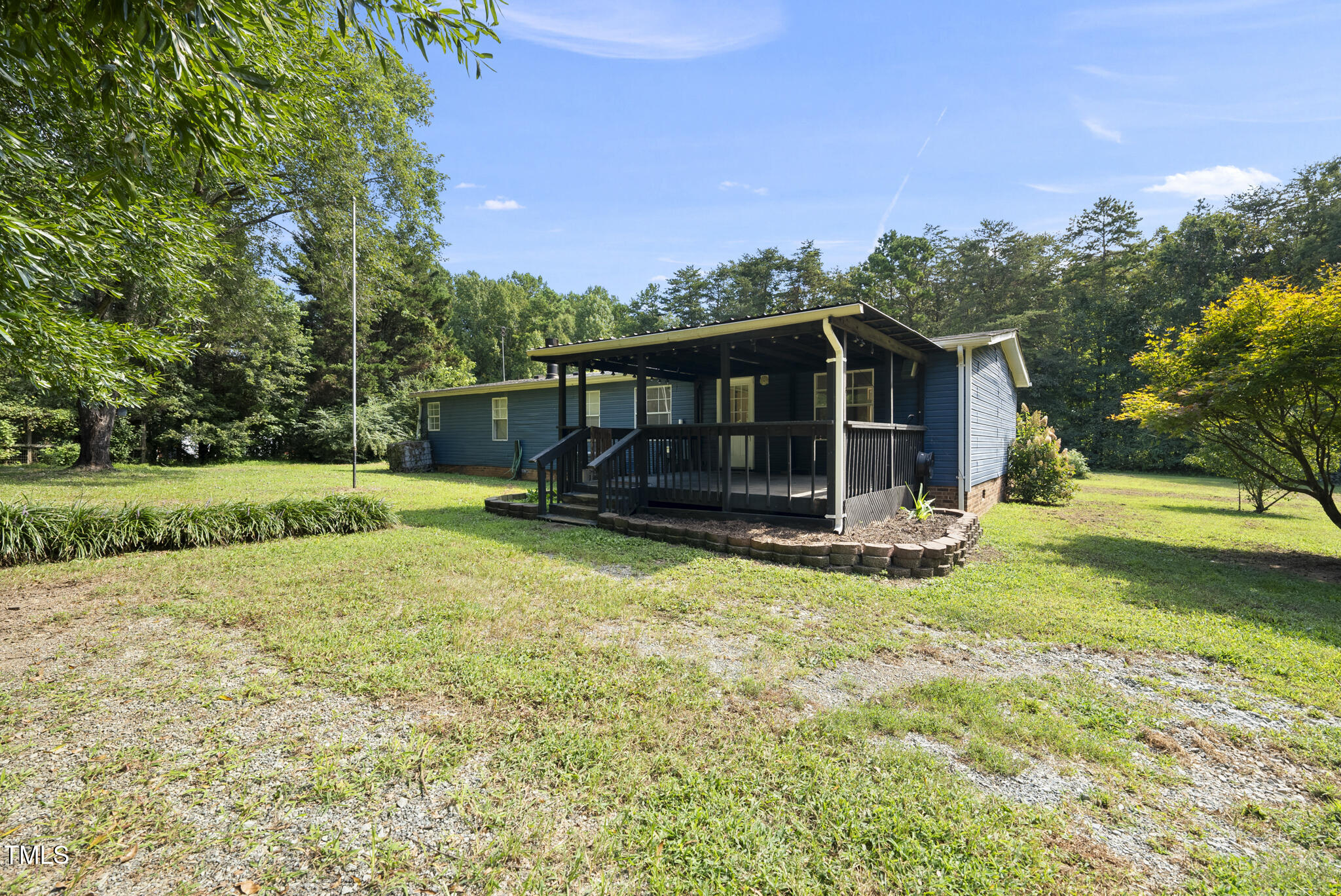 186 Saplin Branch Road Timberlake, NC 27583 - Photo 31 of 46 a view of a house with backyard and sitting area