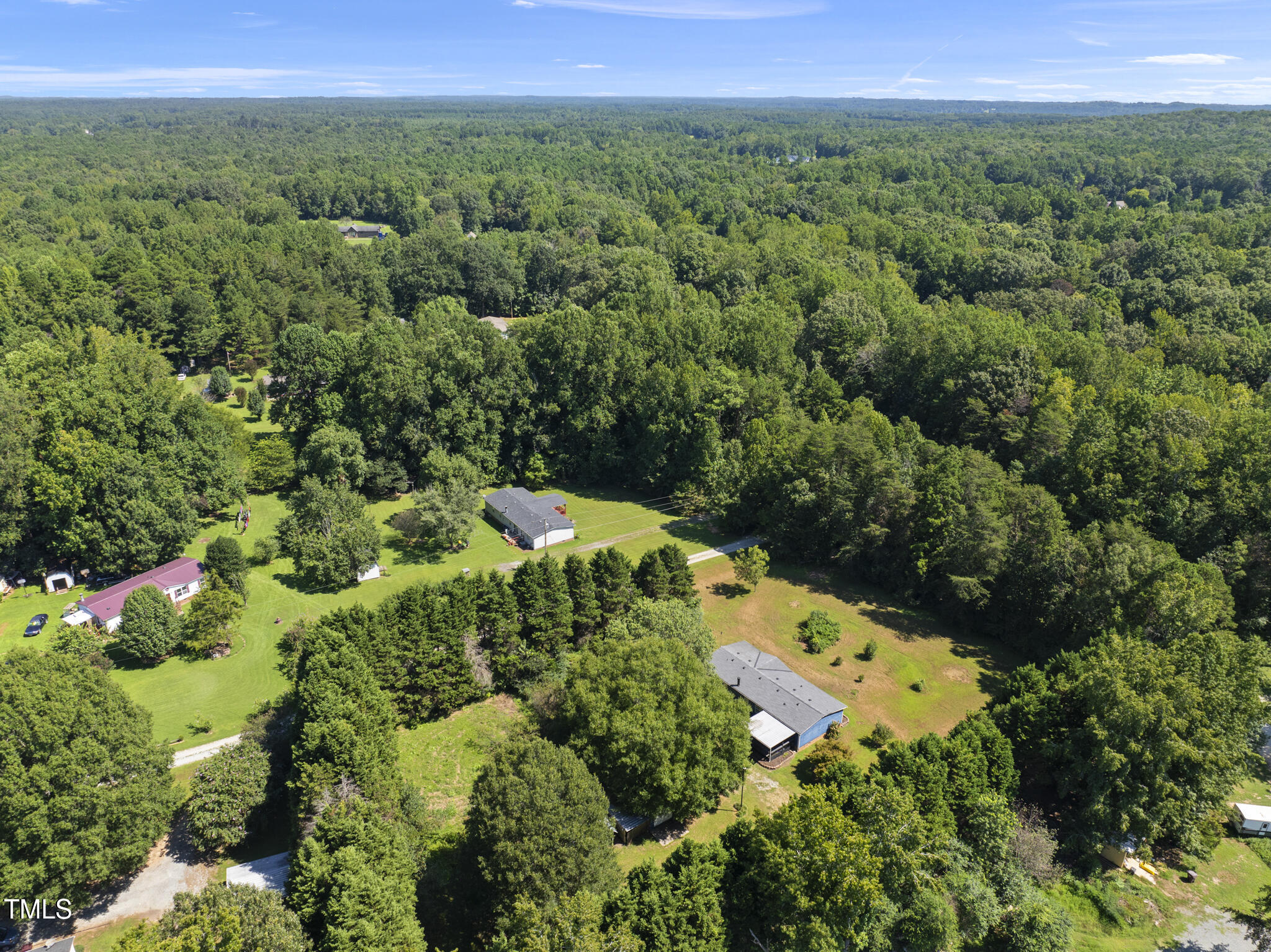 186 Saplin Branch Road Timberlake, NC 27583 - Photo 38 of 46 an aerial view of a house with a yard
