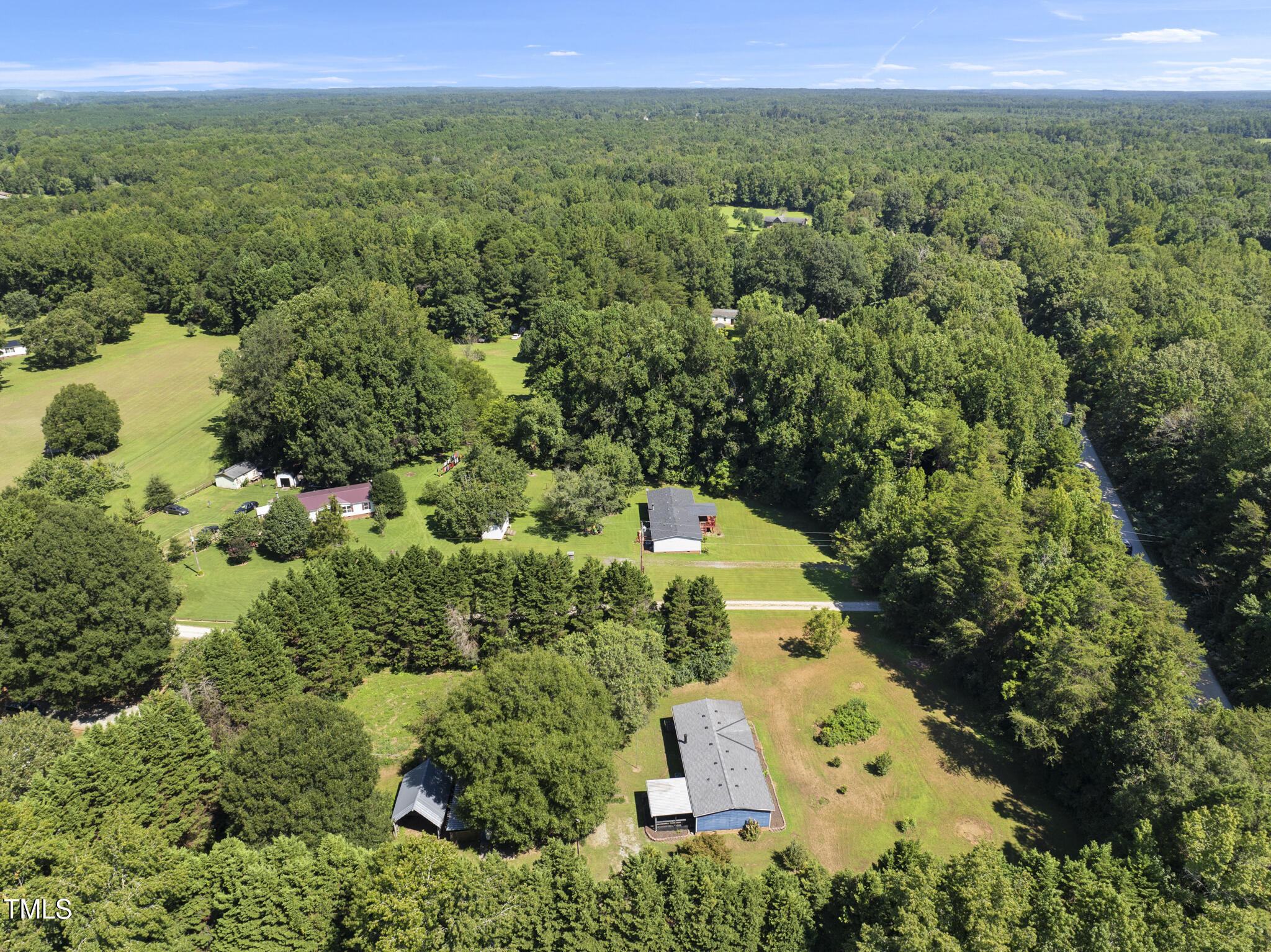 186 Saplin Branch Road Timberlake, NC 27583 - Photo 39 of 46 an aerial view of a house with a yard