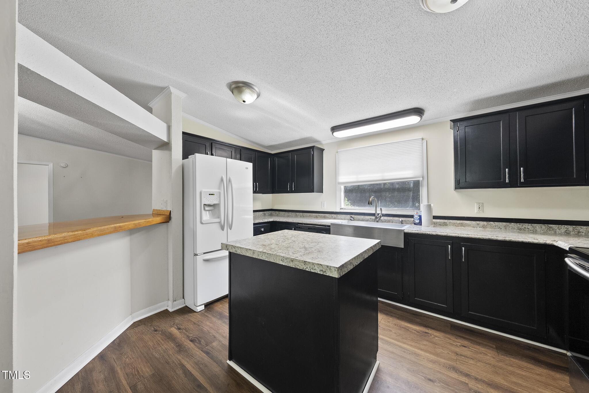 186 Saplin Branch Road Timberlake, NC 27583 - Photo 9 of 46 a kitchen with stainless steel appliances granite countertop a sink stove and refrigerator