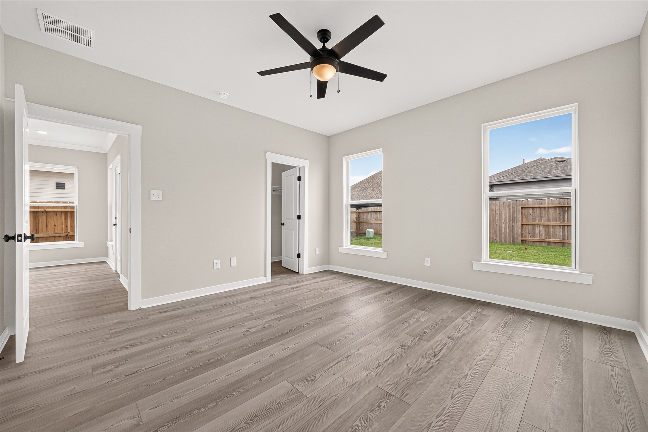 21122 Autumn Heights Rosharon, TX 77583 - Photo 25 of 42 a view of an empty room with window and wooden floor