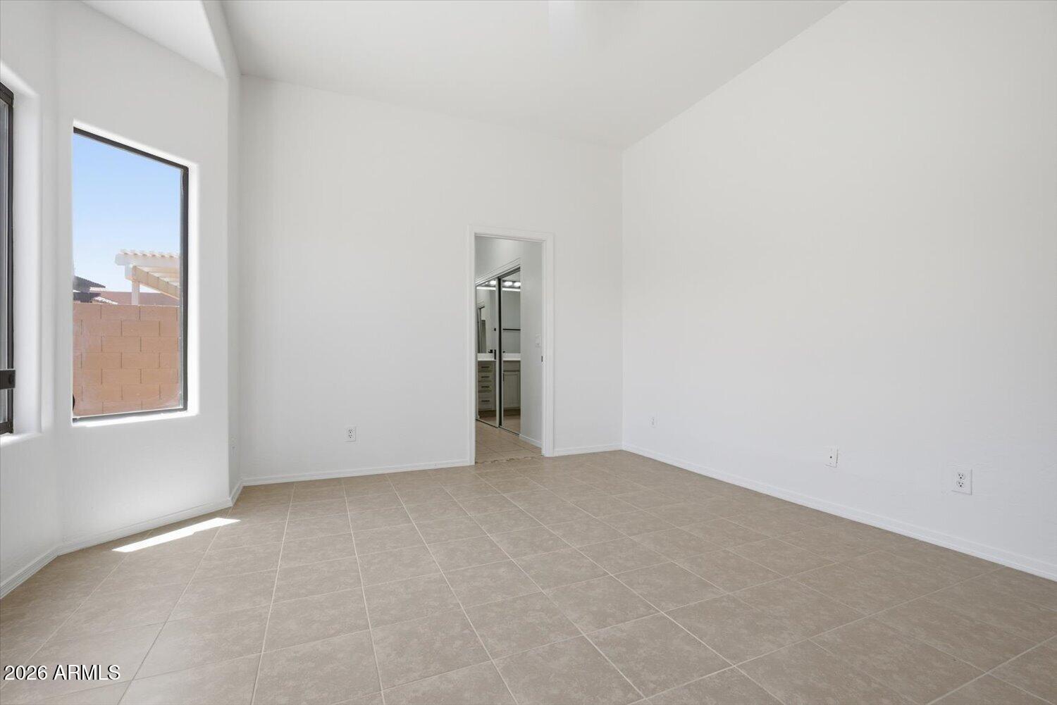 2565 South Signal Butte Road, Unit 23 Mesa, AZ 85209 - Photo 13 of 29 a view of an empty room with a window