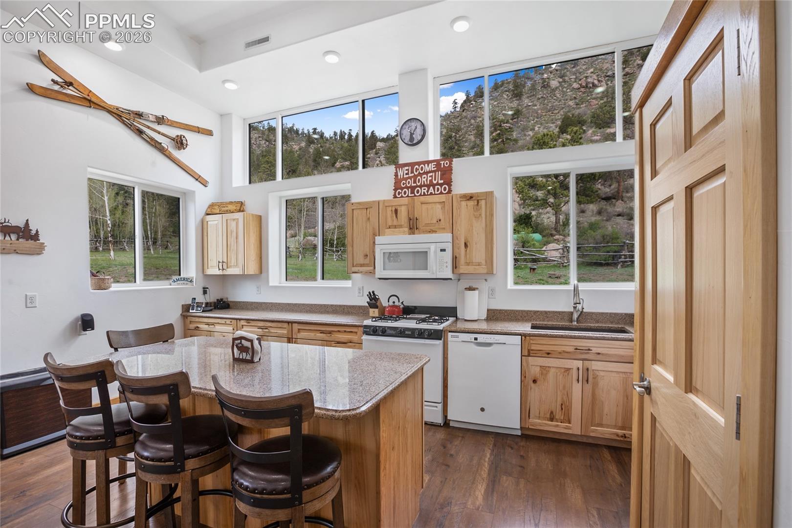 437 Langnis Road Guffey, CO 80820 - Photo 17 of 33 Hickory cabinets, gas stove, even a breakfast bar.