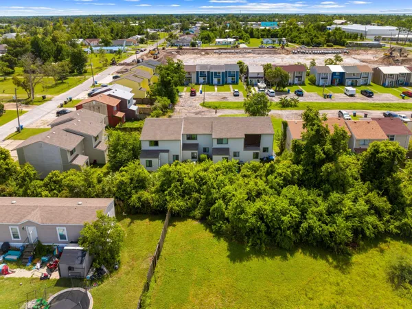 an aerial view of a house with a lake view