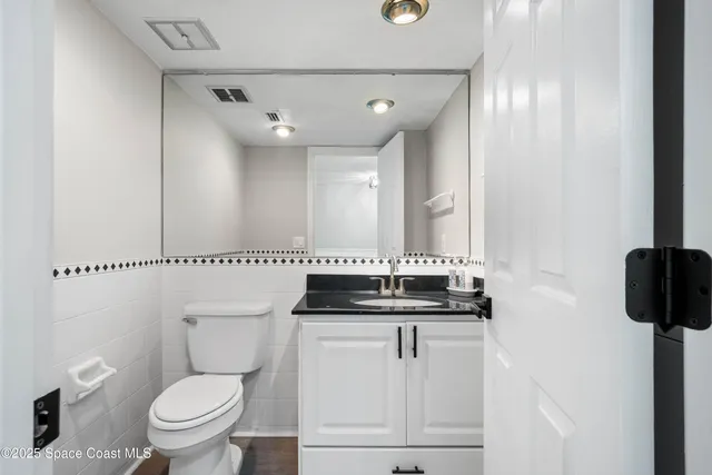 a bedroom with furniture and a flat screen tv