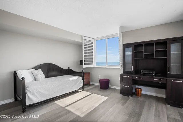 a spacious bathroom with a sink a mirror and a shower