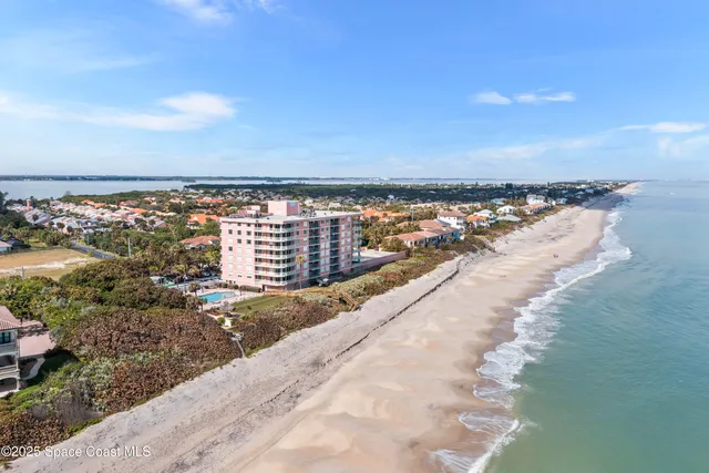 a view of a yard with an ocean view