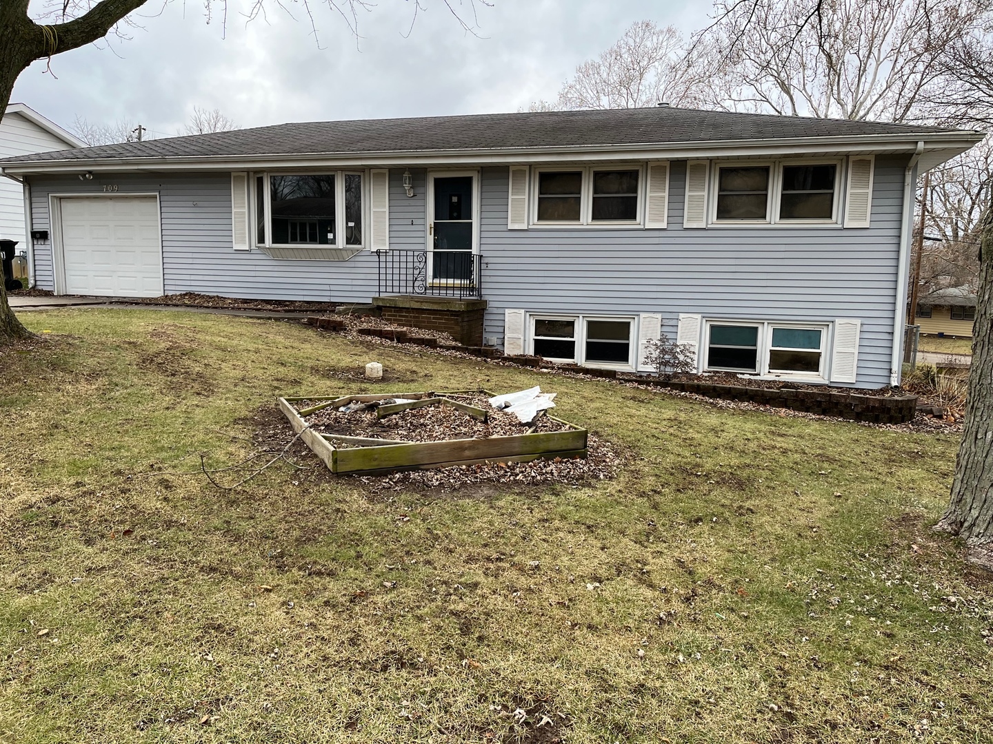 709 Kathleen Drive Normal, IL 61761 - Photo 1 of 32 a front view of a house with a yard