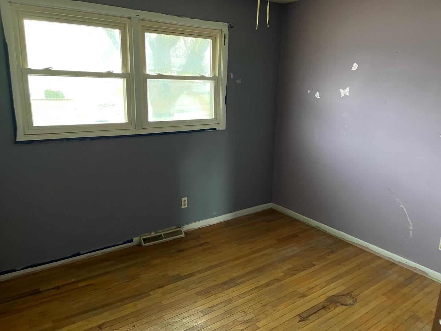 709 Kathleen Drive Normal, IL 61761 - Photo 22 of 32 an empty room with wooden floor and windows