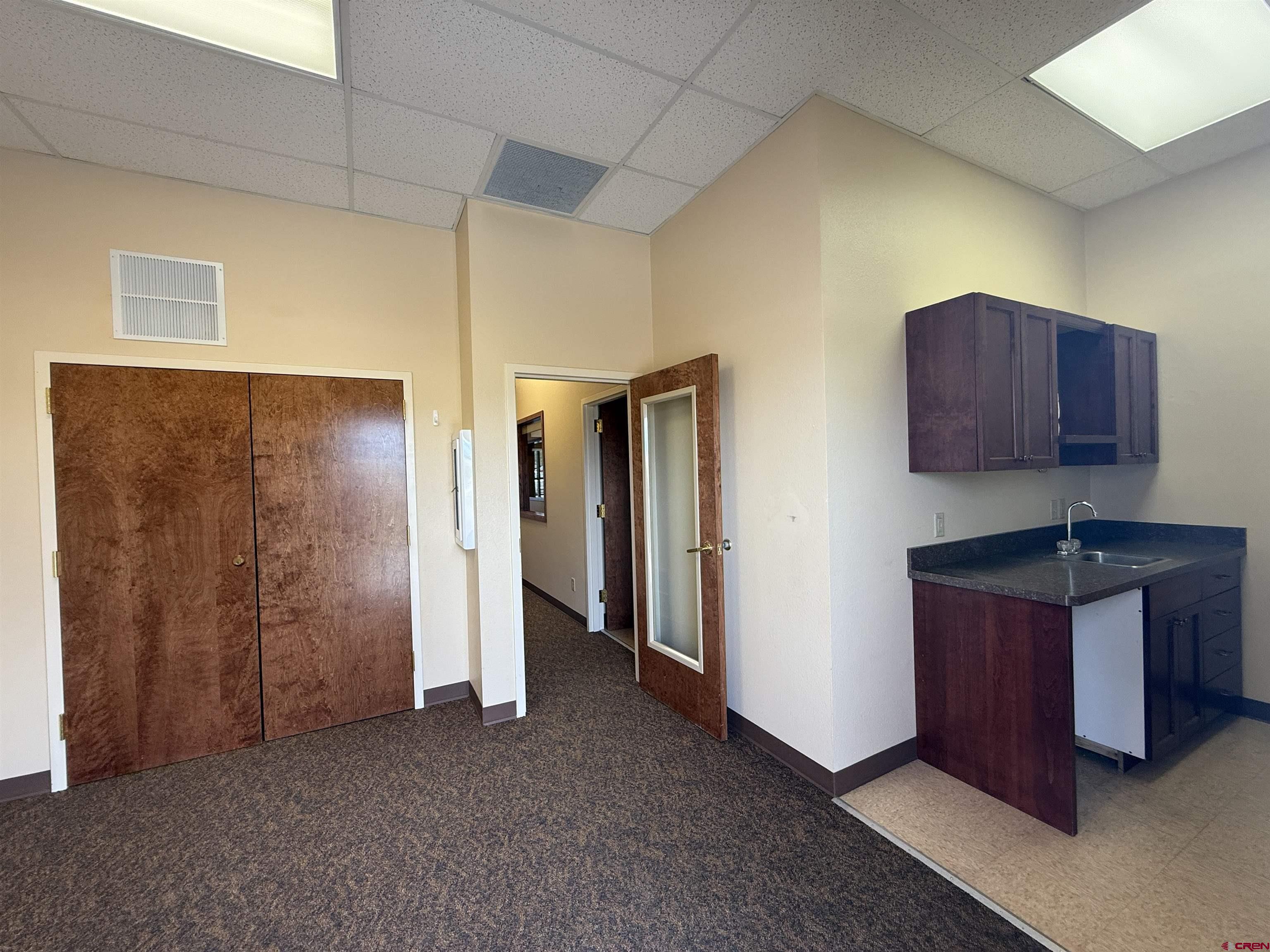 1414 Hawk Parkway, Unit I2 Montrose, CO 81401 - Photo 13 of 20 a view of an empty room and window