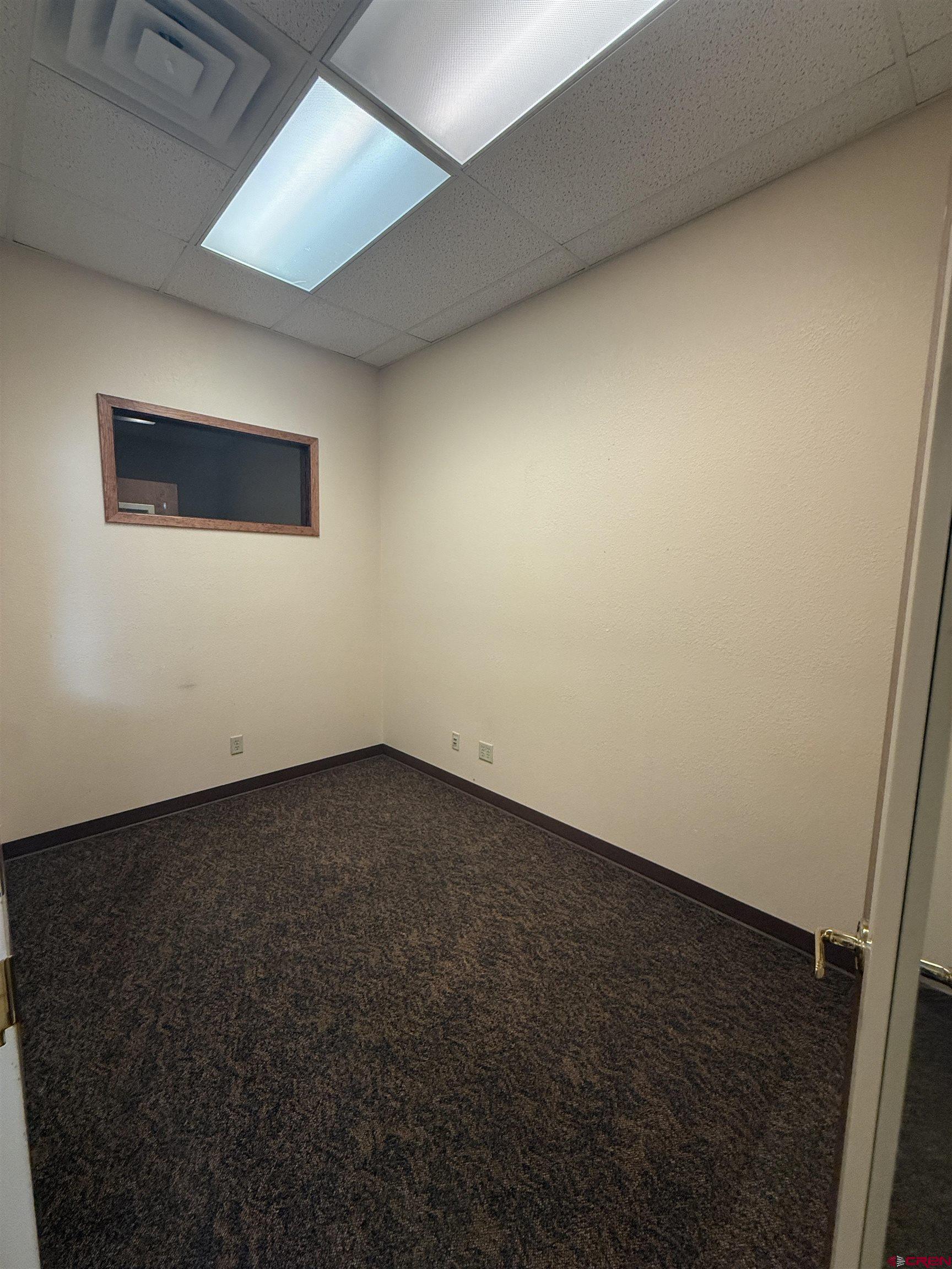 1414 Hawk Parkway, Unit I2 Montrose, CO 81401 - Photo 9 of 20 an empty room with a workbench