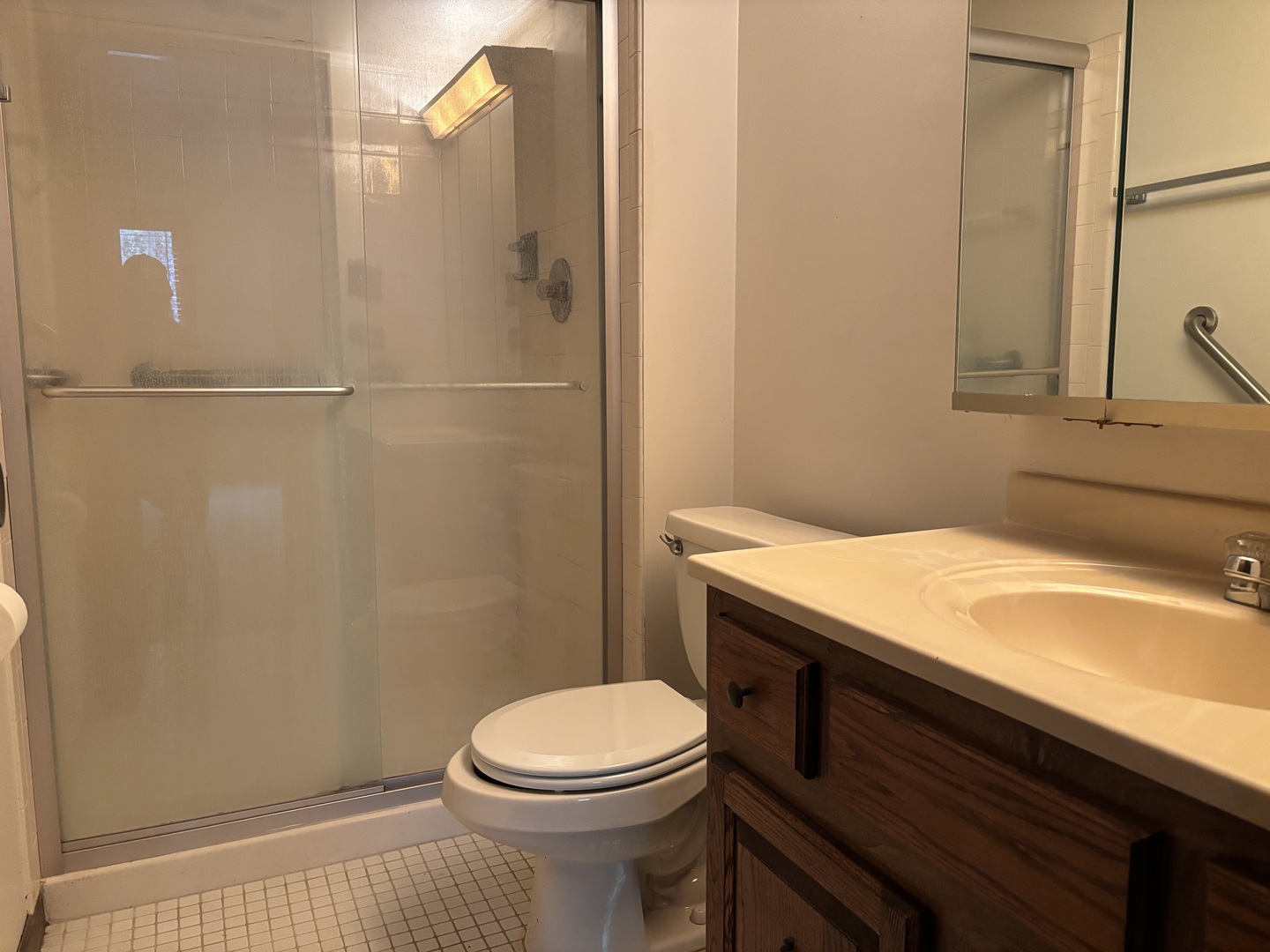 9168 S Road, Unit A Palos Hills, IL 60465 - Photo 9 of 14 a bathroom with a sink a toilet and shower