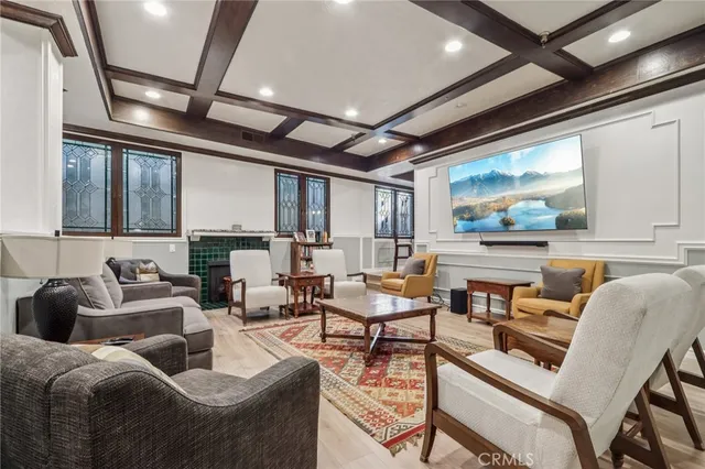 a room with stainless steel appliances kitchen island a large island in the center