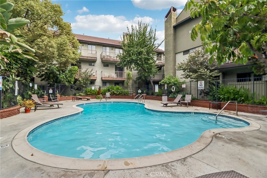 330 Cordova Street, Unit 257 Pasadena, CA 91101 - Photo 26 of 28 a view of a swimming pool with sitting area