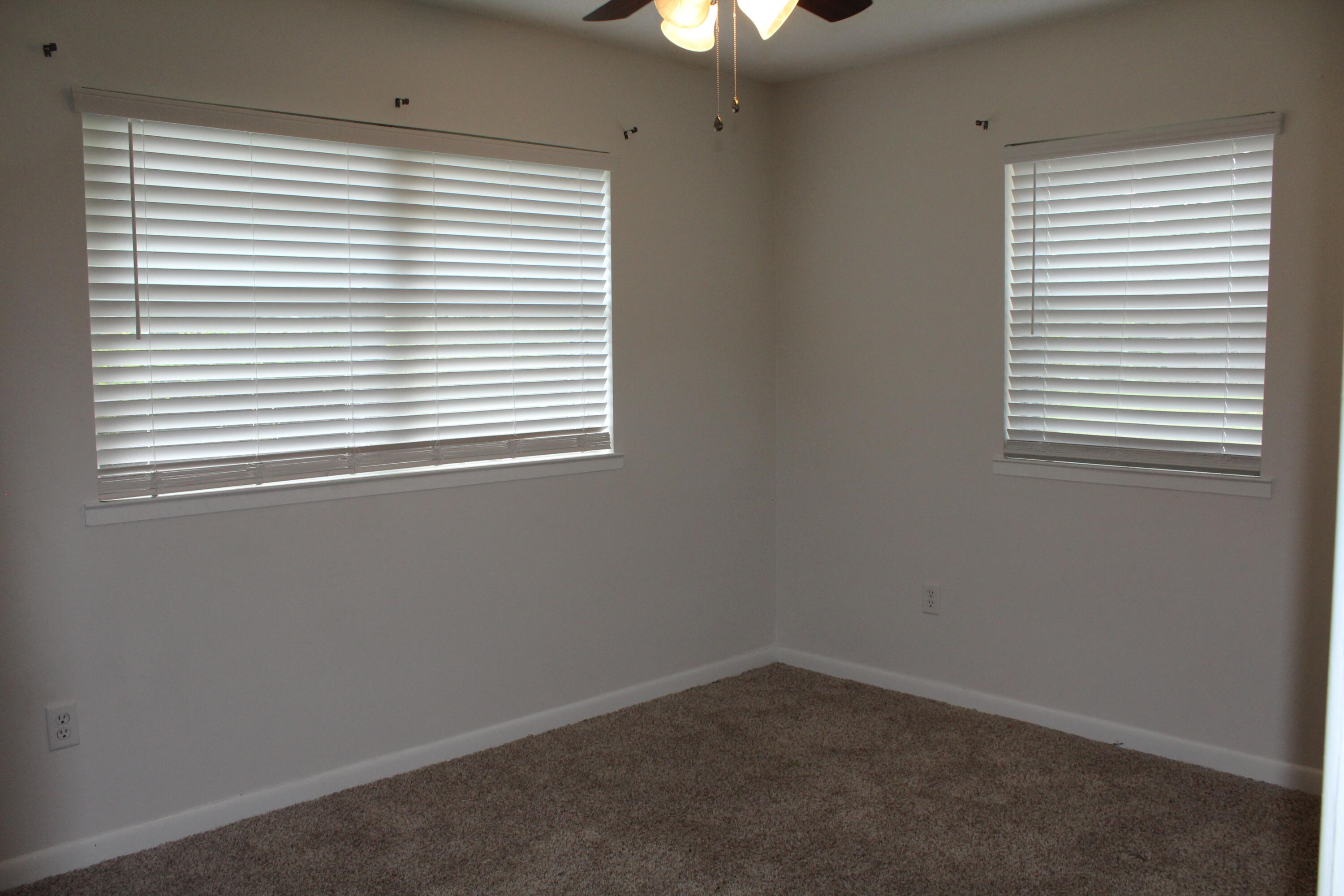 313 Brackin Street, Unit A Crestview, FL 32539 - Photo 11 of 27 an empty room with a window
