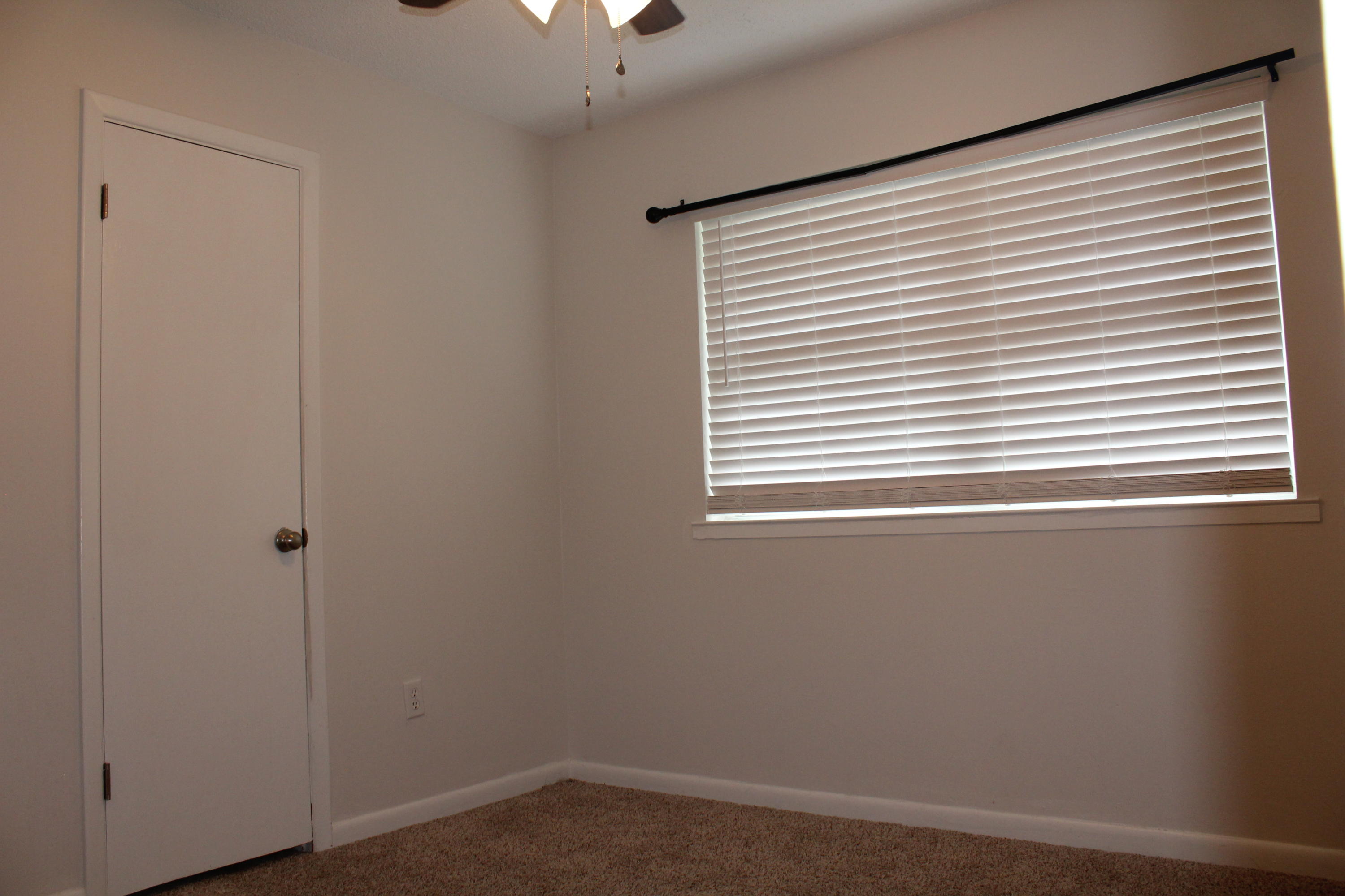 313 Brackin Street, Unit A Crestview, FL 32539 - Photo 12 of 27 an empty room with a window