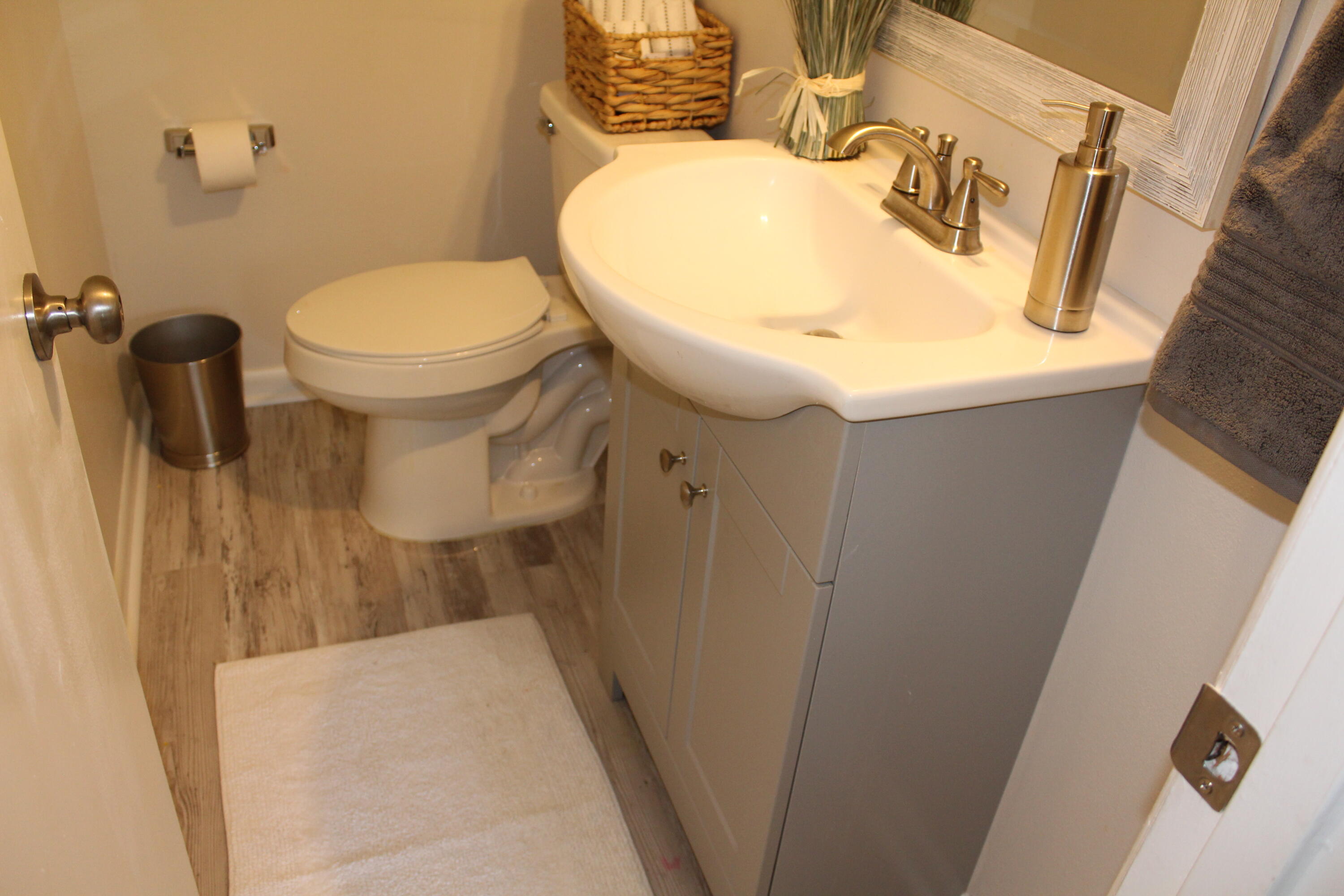 313 Brackin Street, Unit A Crestview, FL 32539 - Photo 17 of 27 a bathroom with a sink and toilet