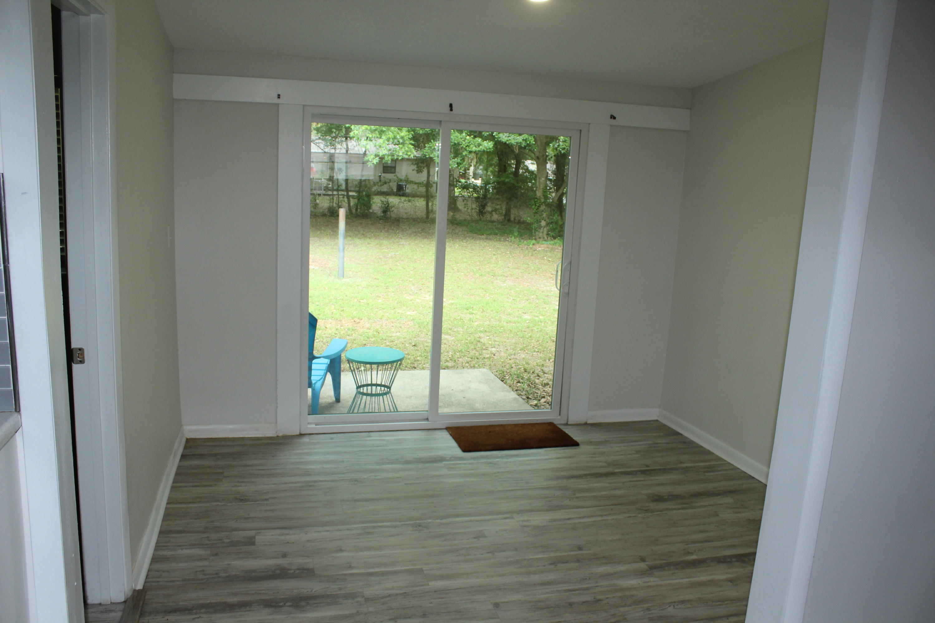 313 Brackin Street, Unit A Crestview, FL 32539 - Photo 20 of 27 a view of an entryway with wooden floor