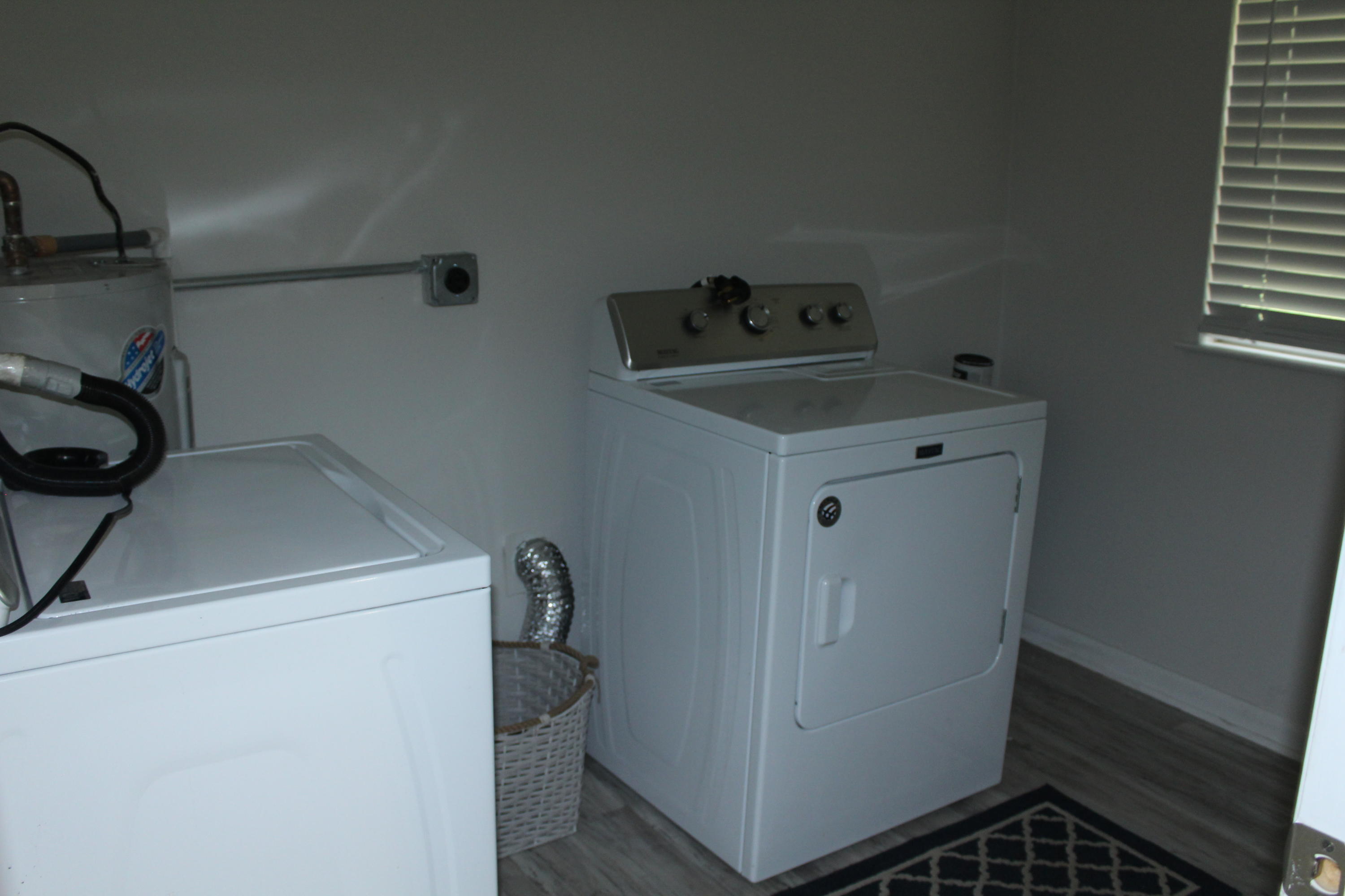 313 Brackin Street, Unit A Crestview, FL 32539 - Photo 23 of 27 a utility room with dryer and washer