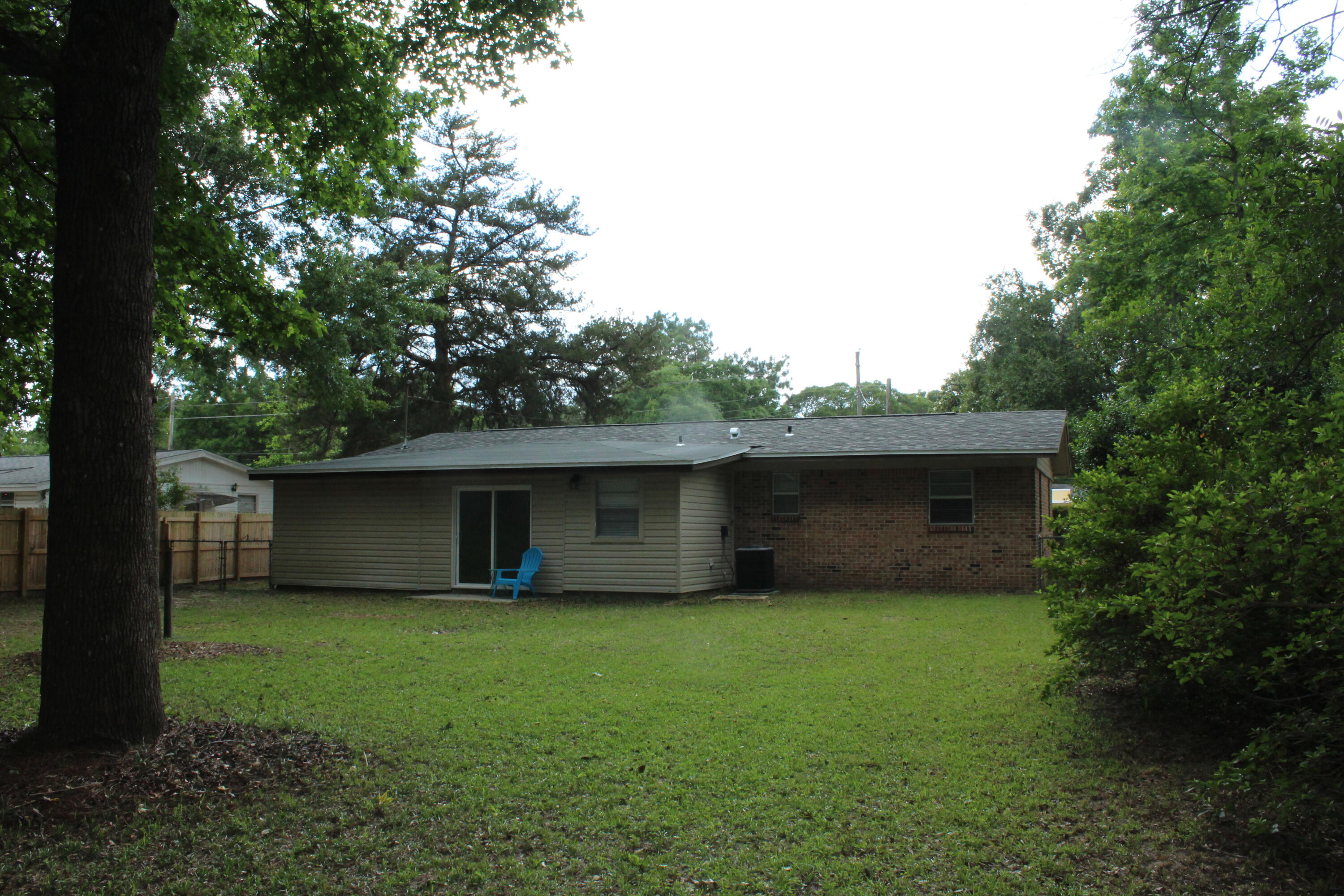 313 Brackin Street, Unit A Crestview, FL 32539 - Photo 3 of 27 a view of a house with a yard