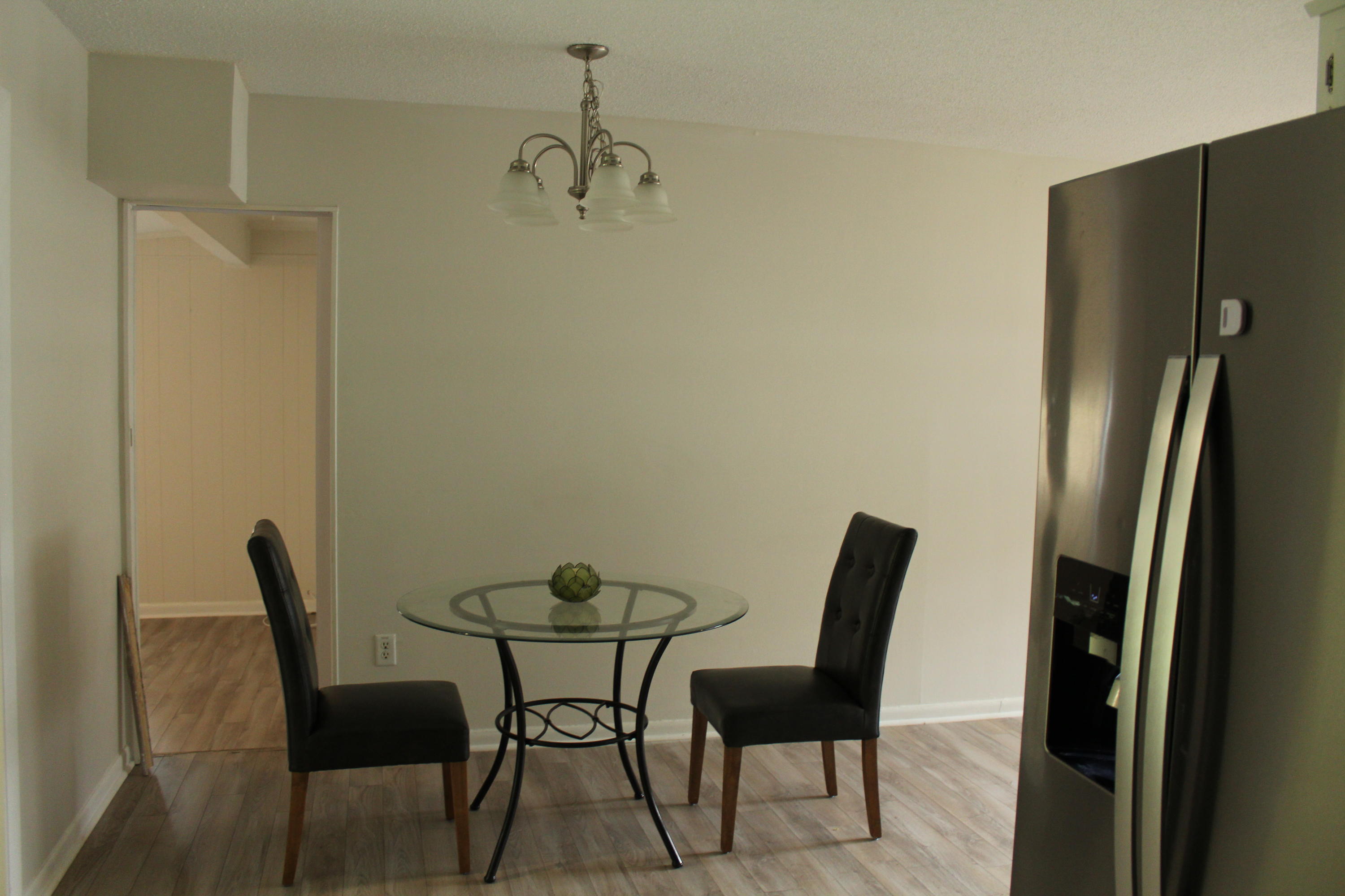 313 Brackin Street, Unit A Crestview, FL 32539 - Photo 8 of 27 a view of a dining room with furniture