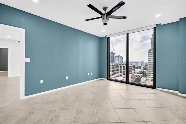 a view of an empty room with a large window