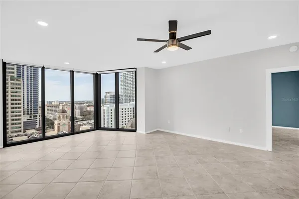 a view of an empty room with a window