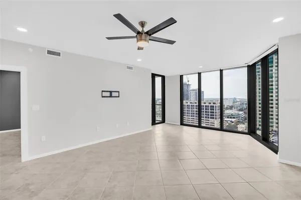 a view of an empty room with a large window