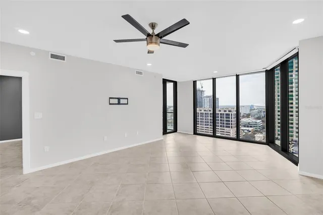 a view of an empty room with a large window