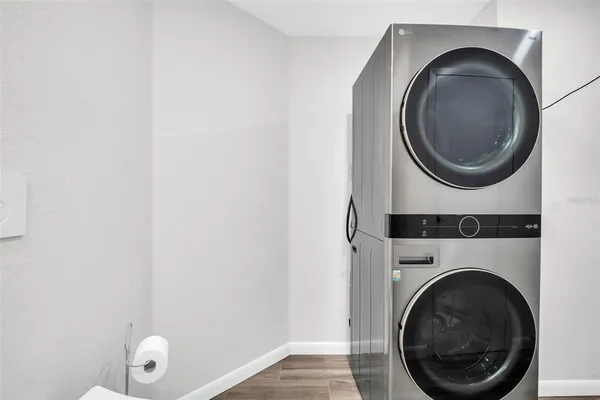 a bathroom with a granite countertop sink toilet and a mirror