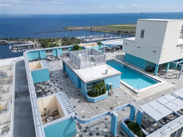 an aerial view of a residential building with an outdoor space