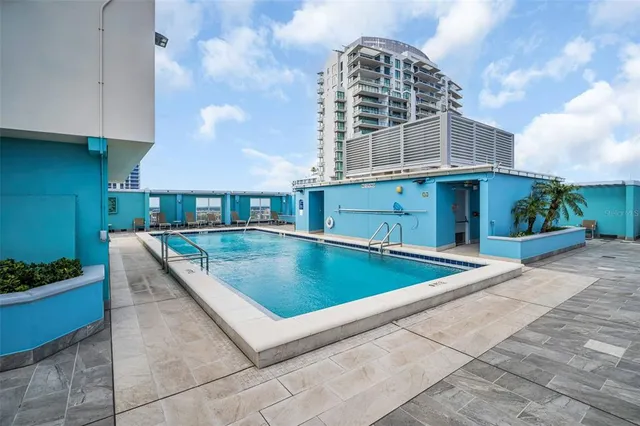 a view of a patio with a table and chairs