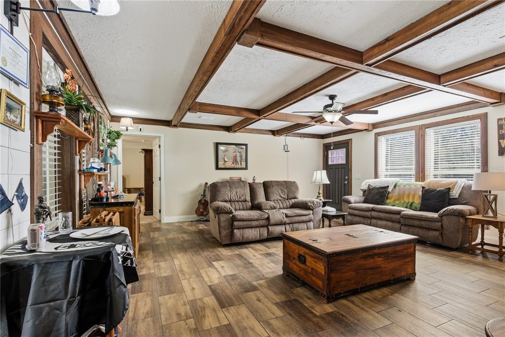 7970 Southwest 14th Place Bell, FL 32619 - Photo 16 of 45 a living room with furniture and a large window