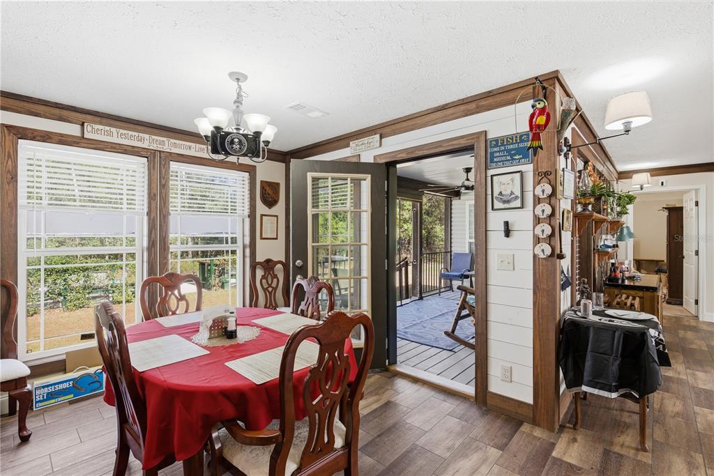 7970 Southwest 14th Place Bell, FL 32619 - Photo 19 of 45 a view of a dining room with furniture window and outside view