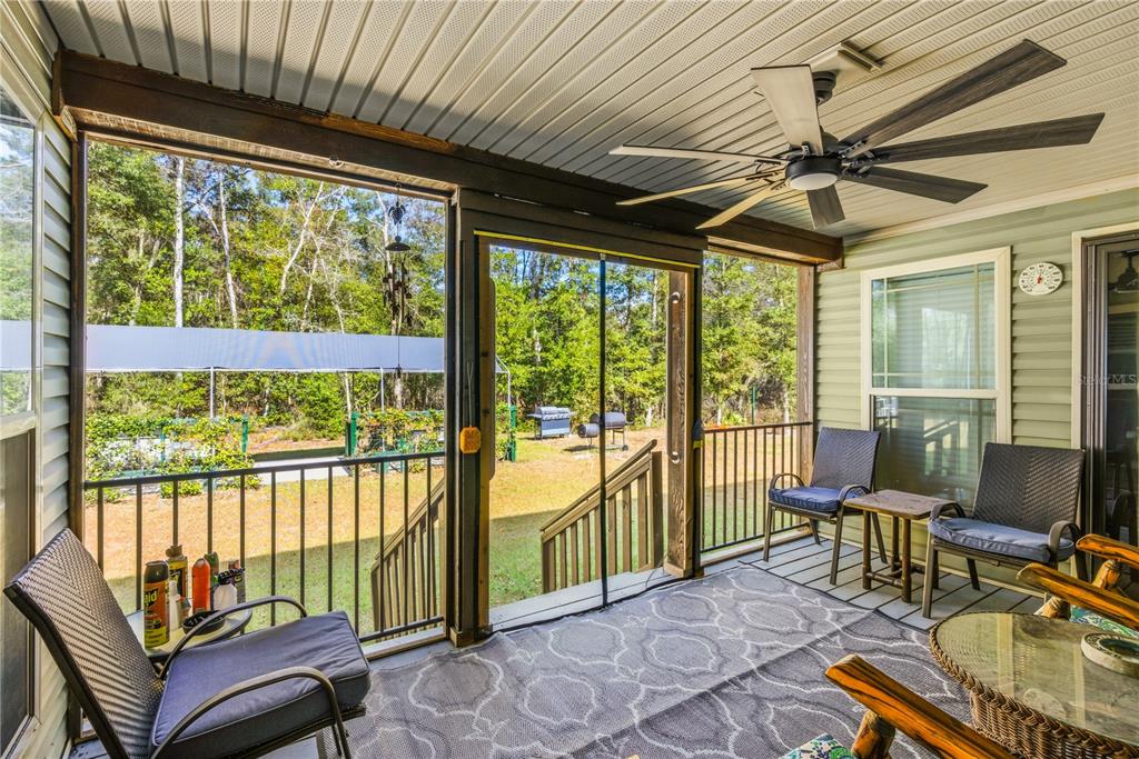 7970 Southwest 14th Place Bell, FL 32619 - Photo 20 of 45 a living room with large windows