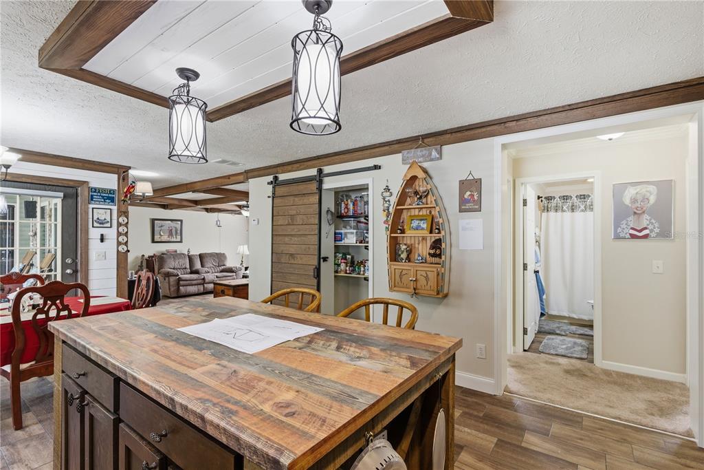 7970 Southwest 14th Place Bell, FL 32619 - Photo 25 of 45 a view of a dining room with furniture