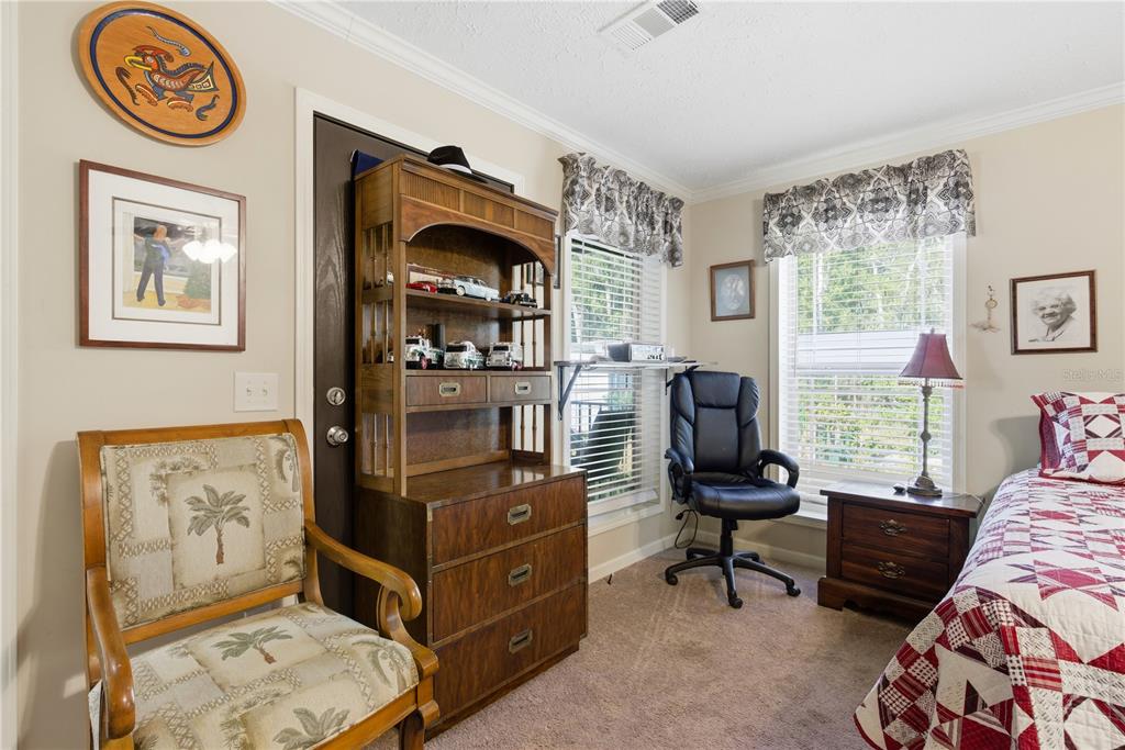 7970 Southwest 14th Place Bell, FL 32619 - Photo 36 of 45 a view of a workspace with furniture and a window