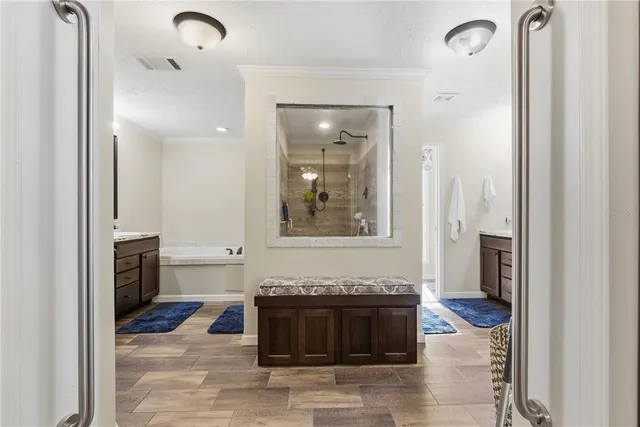 a bathroom with a double vanity sink mirror and