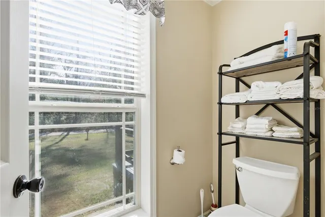 a bathroom with a bathtub sink vanity and mirror