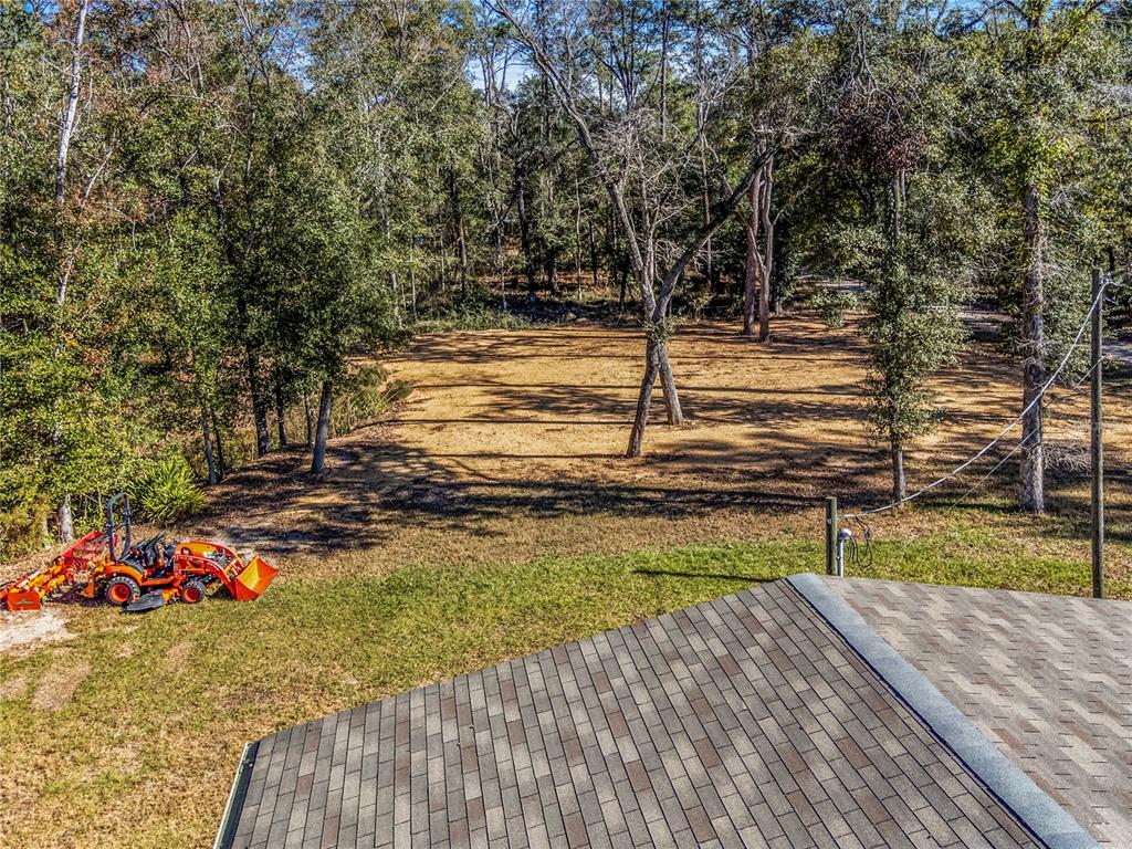 7970 Southwest 14th Place Bell, FL 32619 - Photo 8 of 45 a view of a backyard with wooden floor